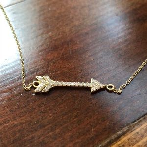 Gold arrow necklace with diamonds